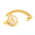 Close-up of golden pacifier clip with letter T, rhinestones and pink background - Letter T