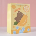 Detail of yellow lemon theme paper gift bag with 100% VC print and sturdy rope handles - Yellow Bear - Small / 14x7x15.5cm