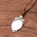Antique silver oval pendant base with brown PU cord and intricate engraved edges - Carved Decoration Oval Style