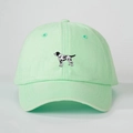 Close-up of mint green washed cotton baseball cap with black and white dog embroidery - One Size / Light Green