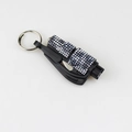 Detail of diamond-studded 2-in-1 emergency car window breaker and seatbelt cutter - Black Leopard