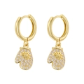 Close-up of golden Christmas glove earrings with white zircon accents on white background - Gold White Zircon Glove