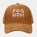 Detailed view of DOG MOM embroidery on premium brown corduroy baseball cap texture - Camel