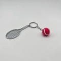 Pink tennis racket and ball keychain accessory with silver finish on a clean grey background - 4.8cm*3.8cm / Metal Tennis Keychain Rose Red