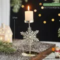 Golden snowflake metal candle holder standing 17cm tall for festive Christmas decor - Snowflake