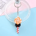 Cartoon orange and white swirl lollipop keychain with a black bow on a pastel background - 5#-Swirl Lollipop