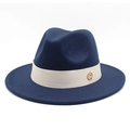Detail of dark blue wool fedora hat featuring a beige ribbon and gold logo badge - Navy Blue
