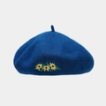 Close-up of three yellow sunflower embroidery on navy blue wool beret fabric texture - One Size / Cyan Blue