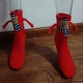 Christmas socks in red featuring plush teddy bear with blue-white scarf and magnetic hands - Red Teddy Bear Decor