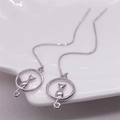 Elegant S925 sterling silver moon cat drop earrings with minimalist silhouette on ceramic - 925 Silver / Platinum