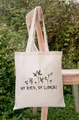 Cream canvas tote bag with 'No Rain No Flowers' floral print in outdoor natural light - STD66-H (Hand Drawn Floral Quote)