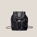 Mochila clásica negra de cuero PU acolchado con cadena dorada y cierre de giro - Negro