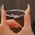 Silver-tone knot bangle featuring micro-pave white cubic zirconia stones in 18k plating - 27# Silver Knot