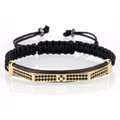 Men's black woven bracelet with gold bar and black zircon stones in a cross design - Gold Pagoda Curved Tube