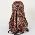Classic leopard print satin silk headscarf tied on a model with brown border accents - Dark Coffee