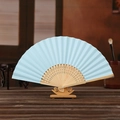Light blue DIY paper folding fan with carved bamboo ribs on a wooden display stand - Light Blue