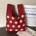 Polka dot knitted gift tote bag in dark red with cream white pattern and top handles - Red Polka Dot