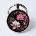Tai Chi keychain featuring lotus flower design in a glass dome round pendant - Lotus Yin Yang Fish