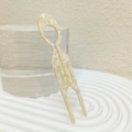 Macro shot of cream cellulose acetate U-shaped hair fork with elegant marble texture - Ivory White Large