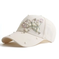 Creamy white cotton baseball cap featuring pearl butterfly and sparkling rhinestone details - Off White