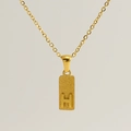 Close-up of a gold rectangle pendant with a 3D embossed letter H and frosted texture - Letter H