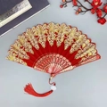 Red Chinese folding fan with golden floral embroidery and red silk tassel accessory - With Large Tassel / Red