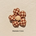 Close-up of a 5.5cm checkered fabric flower accessory with padded petals and a center button - Checkerboard Khaki