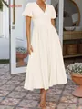 Sommerliches Midikleid in Apricot mit V-Ausschnitt, Puffärmeln und plissierter Textur - XS / Aprikose