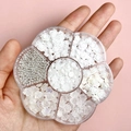 Mix of white resin flowers and pearls in a clear plum-shaped nail art jewelry storage box - #05 White Series Set