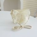 Detail view of a cream beige straw shoulder bag with a large white lace bow for girls - 52cm (3-6 Years) / Bag / Cream