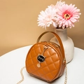 Deep brown quilted round handbag with cat charm and gold chain strap for women - Tan