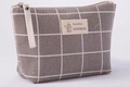 Macro shot of grey plaid canvas makeup bag with Natural Style handmade fabric label - Grey Grid