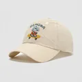 Detail of embroidered skateboarding dinosaur on breathable beige cotton kids baseball cap - 54cm (3-8 Years Old) / Beige
