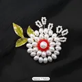 Luxurious handmade pearl snowflake brooch with red beads and green enamel leaves - Pearl Flower Tale-F Enamel Leaf