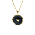 Macro detail of gold-plated necklace with black enamel disc and centered golden star - Black Star
