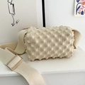 Detail of cream-colored knit crossbody bag with unique 3D bubble texture and wide strap - Apricot