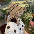 Khaki hollow-out crochet straw hat with black horizontal stripes shown on a model - M / Crisscross Color Block Bucket Hat-Khaki
