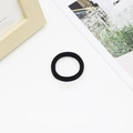 Detail of a black high-elasticity seamless hair tie on a minimalist lifestyle background - 4cm Black (0.6g)