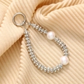 Macro detail of luxury phone charm with large pearls and sparkling crystal spacers - White Rhinestone Ring & 2 AB Plated White Beads