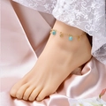 Golden starfish anklet with light blue natural stones on soft pink silk background - Fish