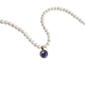 Detail of round white pearl necklace featuring a blue gemstone pendant in rose gold - September Sapphire Blue