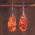 Detailed view of teardrop natural stone earrings hanging on a rustic wooden branch - Reddish Brown with White Spots Style (ER1025-24)