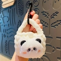 Handcrafted panda crochet plush bag charm and earphone case with soft white fur texture - Panda Style
