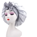 Detail of silver satin sleep cap with large bow knot and pleated glossy fabric texture - Cross-Silver