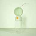 Portable pet water bottle in mint green with foldable bowl and orange control button - Travel Cup / Green