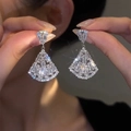 Silver drop tassel earrings with teardrop zircon stones held by a model for elegant style - 80# Silver Needle - Silver