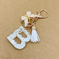 Letter B keychain with white stones, gold foil, butterfly charm and white tassel accessory - Letter B