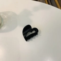 Close-up of a black heart-shaped acetate hair claw clip on a minimalist white surface - Approx. 4cm / Matte Black