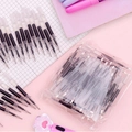 Stylo féerique à paillettes liquides colorées sur un fond de papier quadrillé - Recharges de Stylo Sables Mouvants 10pcs