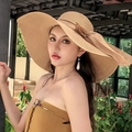 Elegant khaki flat top straw hat featuring a large decorative bow and wide sun brim - One Size / Solid Khaki